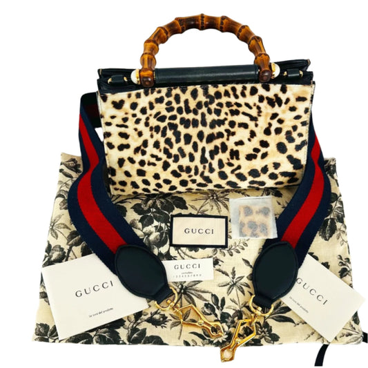 Authentic Gucci Nymphaea Leopard Calf Hair
Bag w/Bamboo Pearl Handles - Clairely Amazing