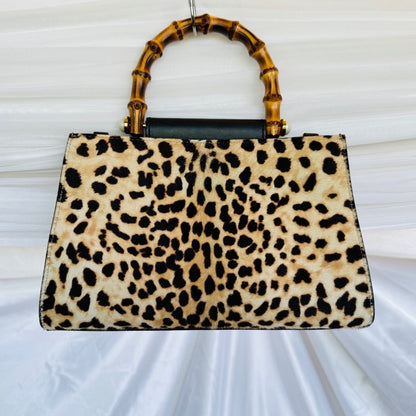 Authentic Gucci Nymphaea Leopard Calf Hair
Bag w/Bamboo Pearl Handles - Clairely Amazing