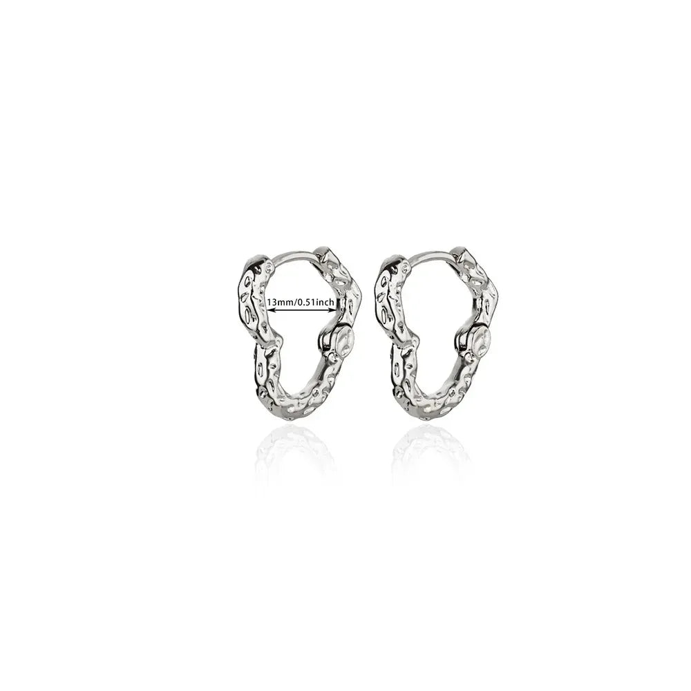 Hollow zircon heart earrings