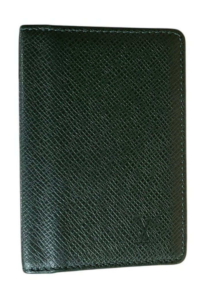 Green textured wallet on a white background