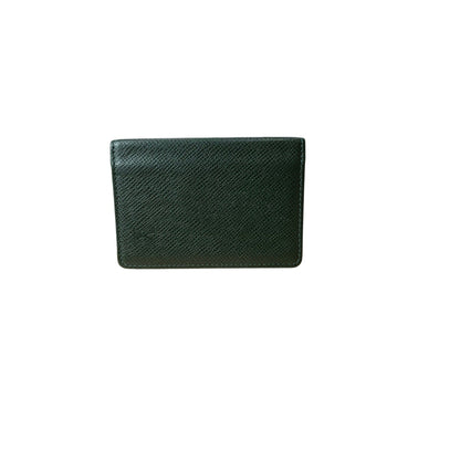 Green textured wallet on a white background