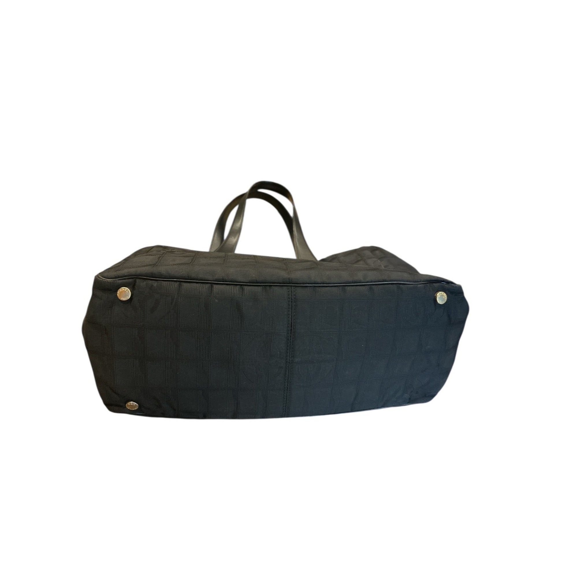 Black duffel bag with gold buttons on a white background