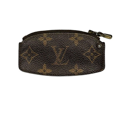 Designer pouch with monogram pattern on a white background