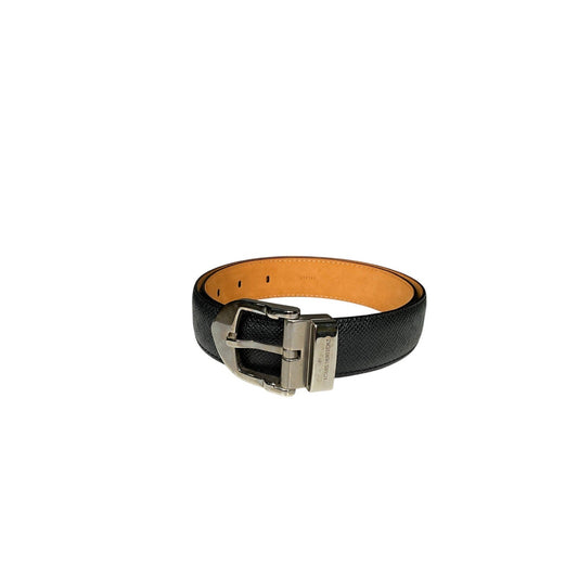 Black leather belt with a silver buckle on a white background