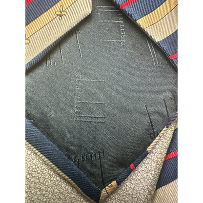 Close-up of a fabric texture with a brand logo on a striped background