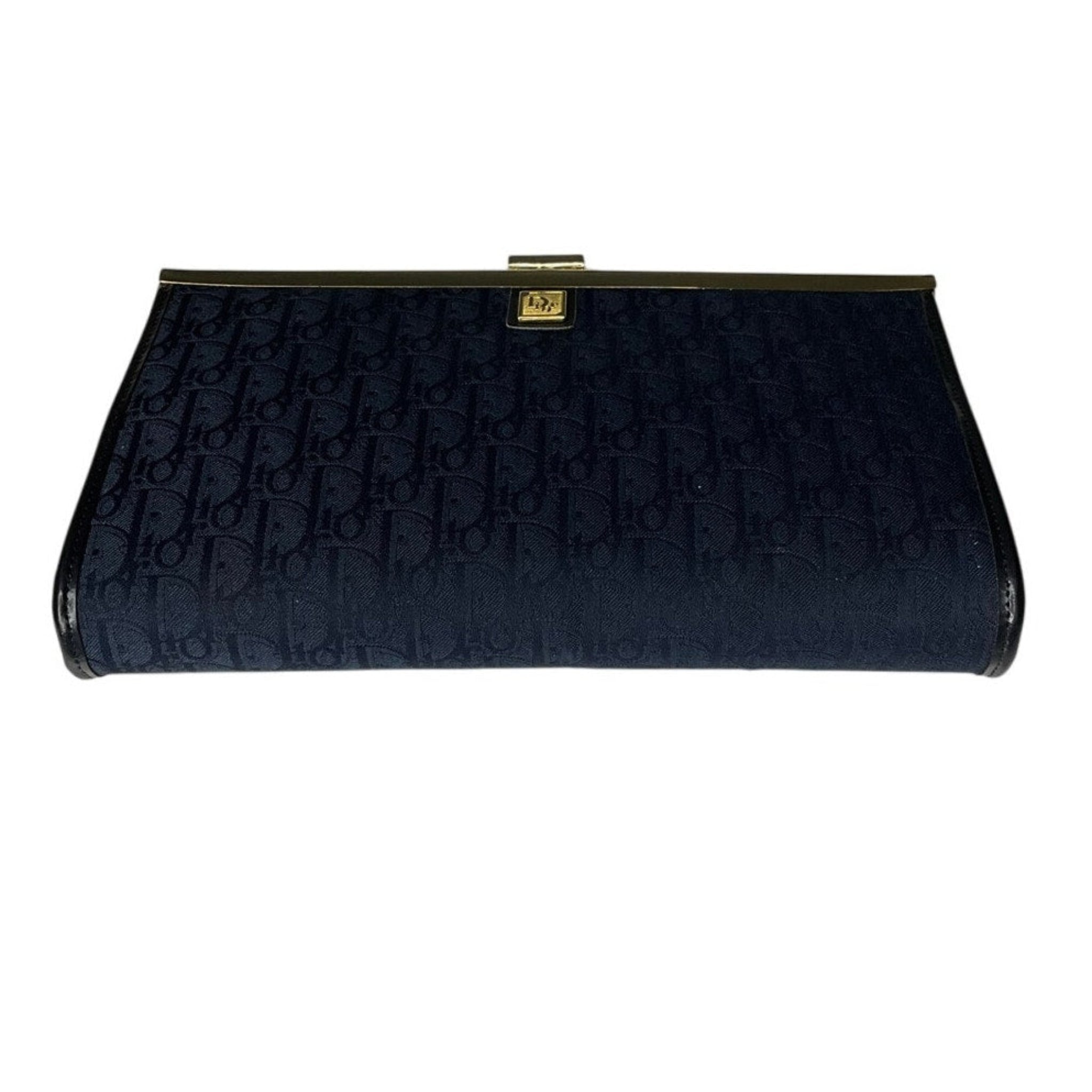 Black clutch bag with gold clasp on a white background