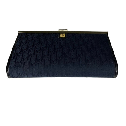 Black clutch bag with gold clasp on a white background