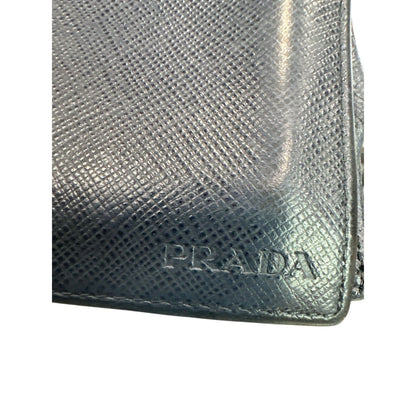 Silver Prada wallet on a white background