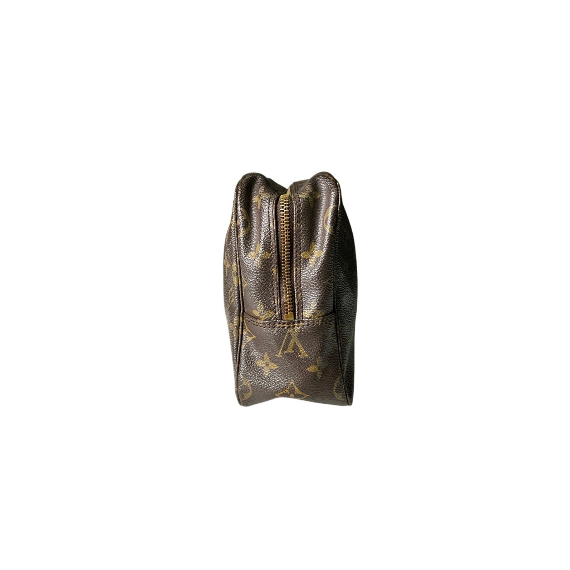 Small pouch with a gold zipper and monogram pattern on a white background