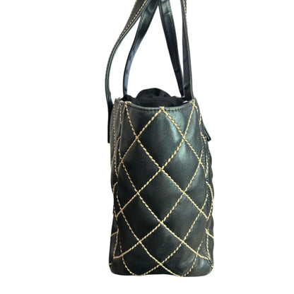 Black handbag with gold stitching on a white background