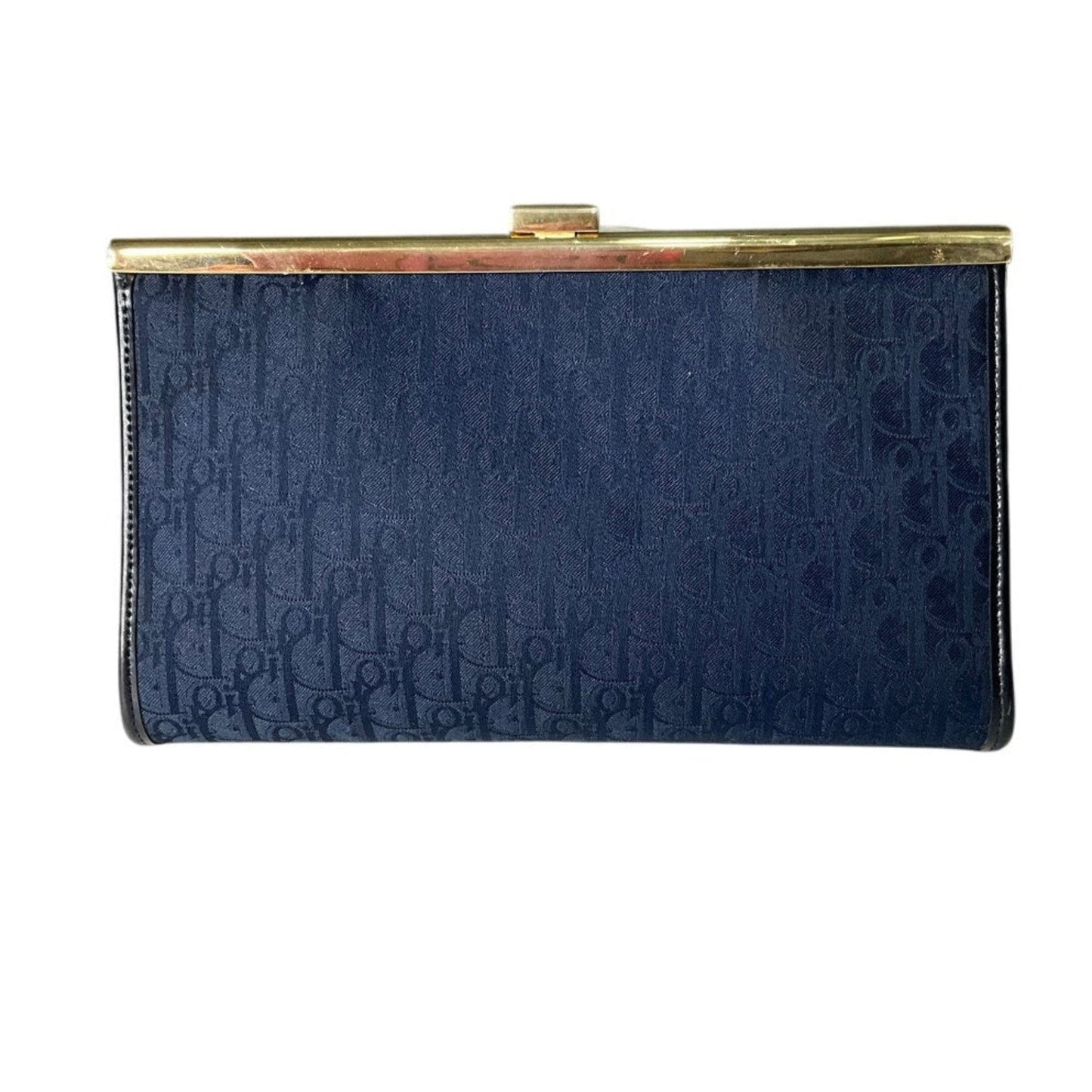 Navy blue clutch bag with gold clasp on a white background