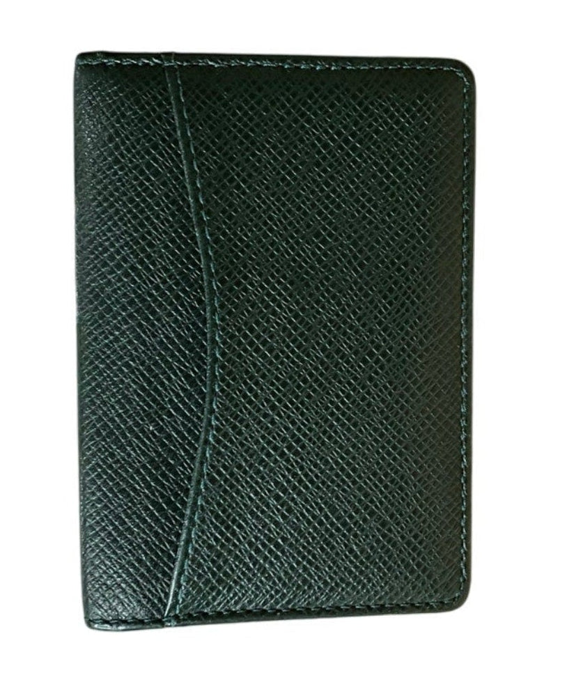 Green leather cardholder on a white background