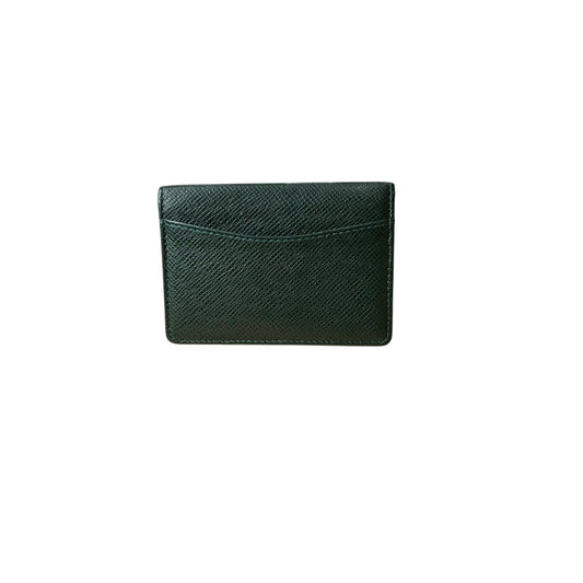 Green leather cardholder on a white background