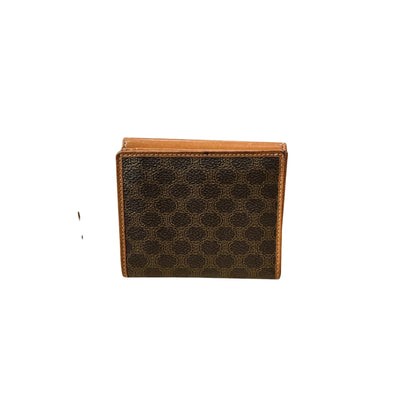 Brown leather wallet with a honeycomb pattern on a white background