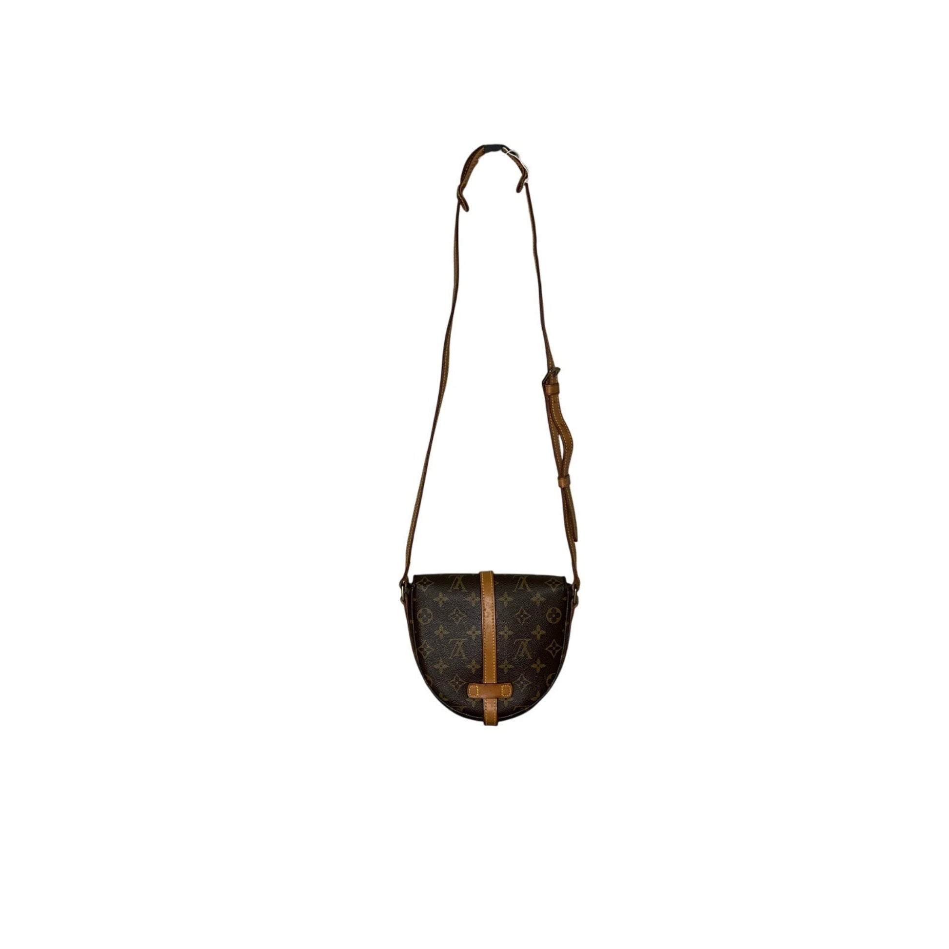 Small brown leather bag with a strap on a white background