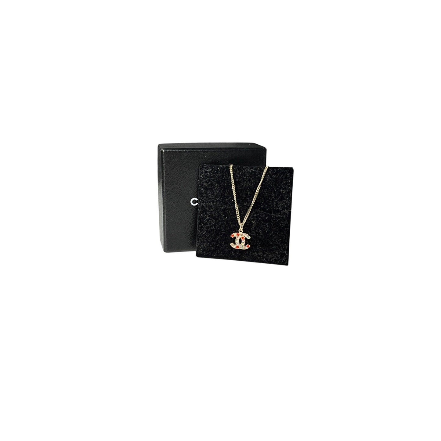 Necklace with a pendant in a black jewelry box on a white background
