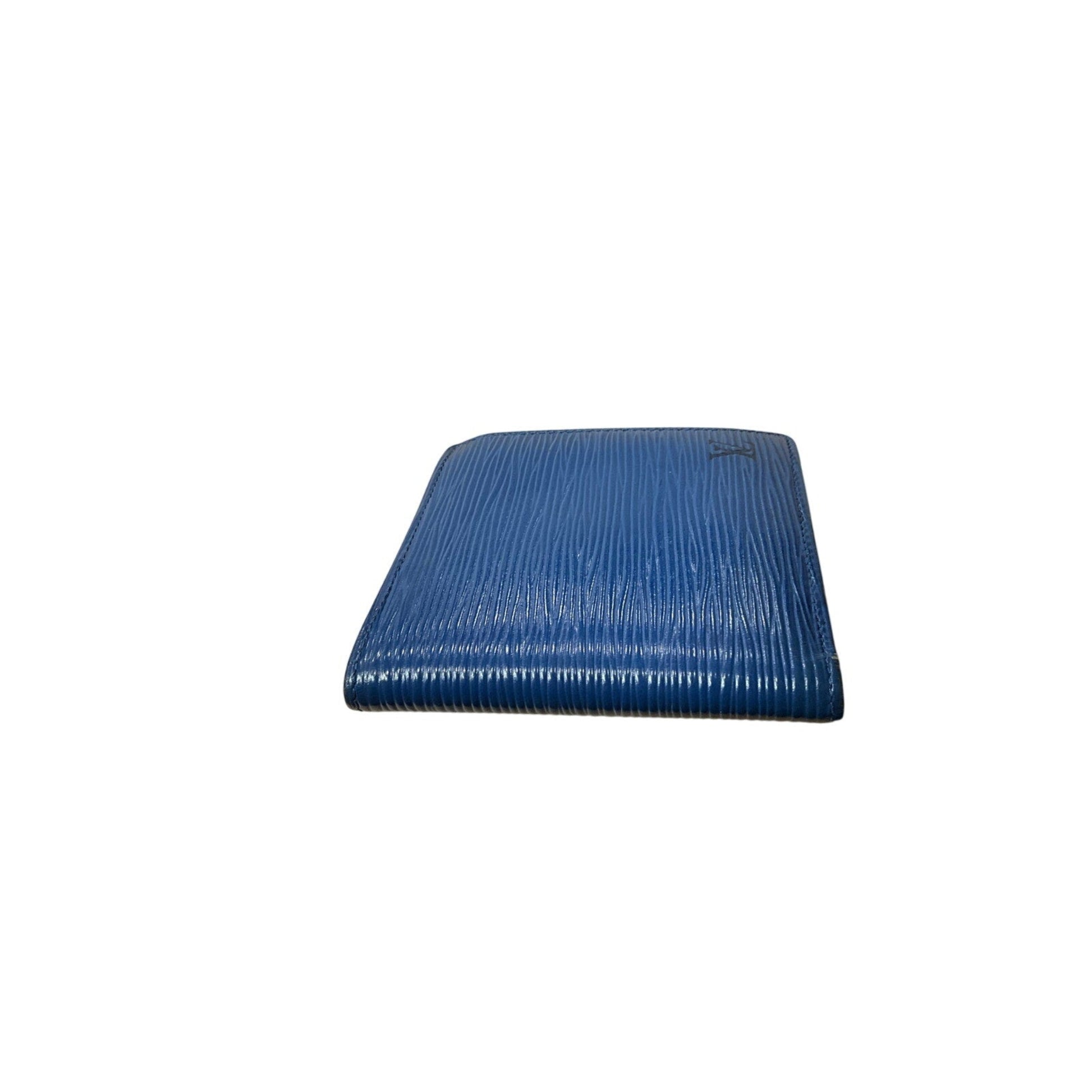 Blue cushion with a ribbed texture on a white background