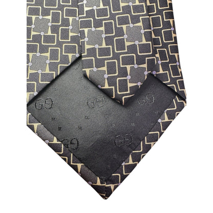 Patterned tie and matching pocket square with Gucci logo on a white background