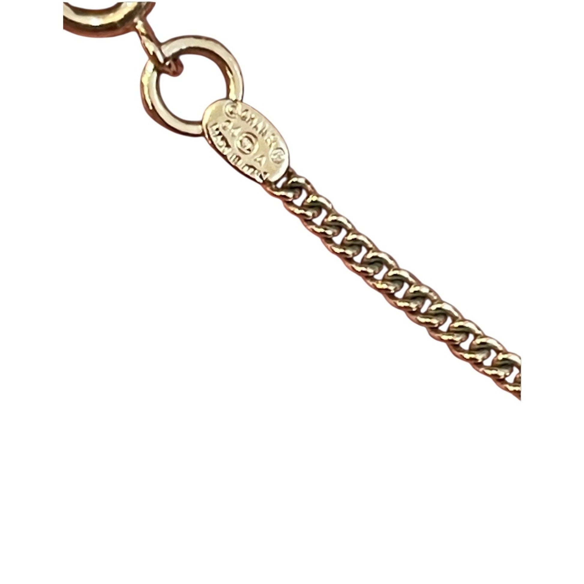 Gold chain bracelet with a clasp on a white background