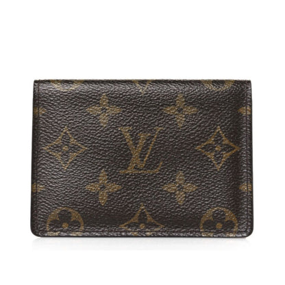 Louis Vuitton wallet with monogram pattern on a white background