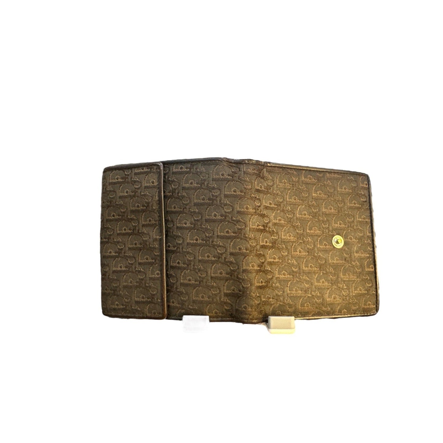 Brown wallet with gold pattern on a white background