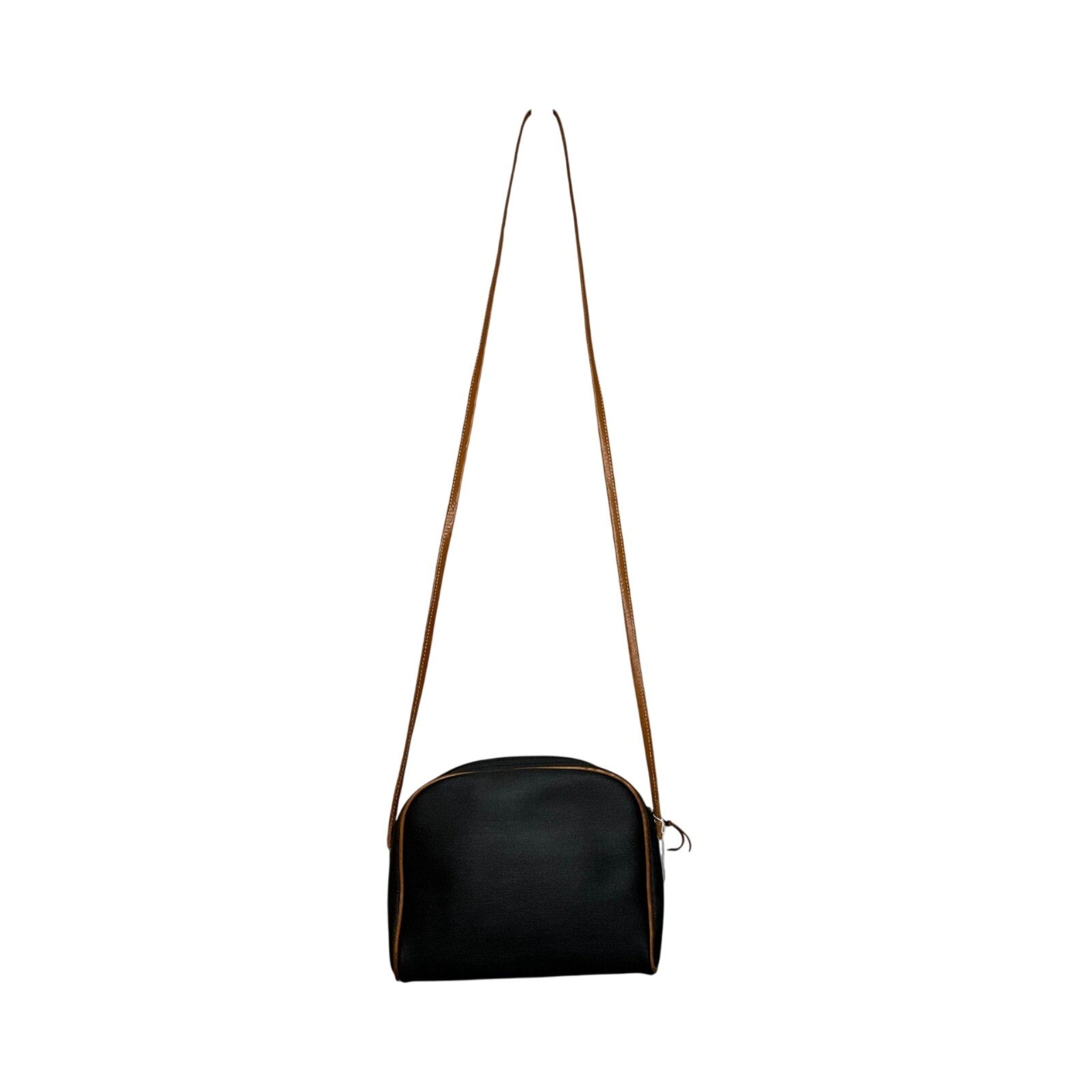Black shoulder bag with a strap on a white background