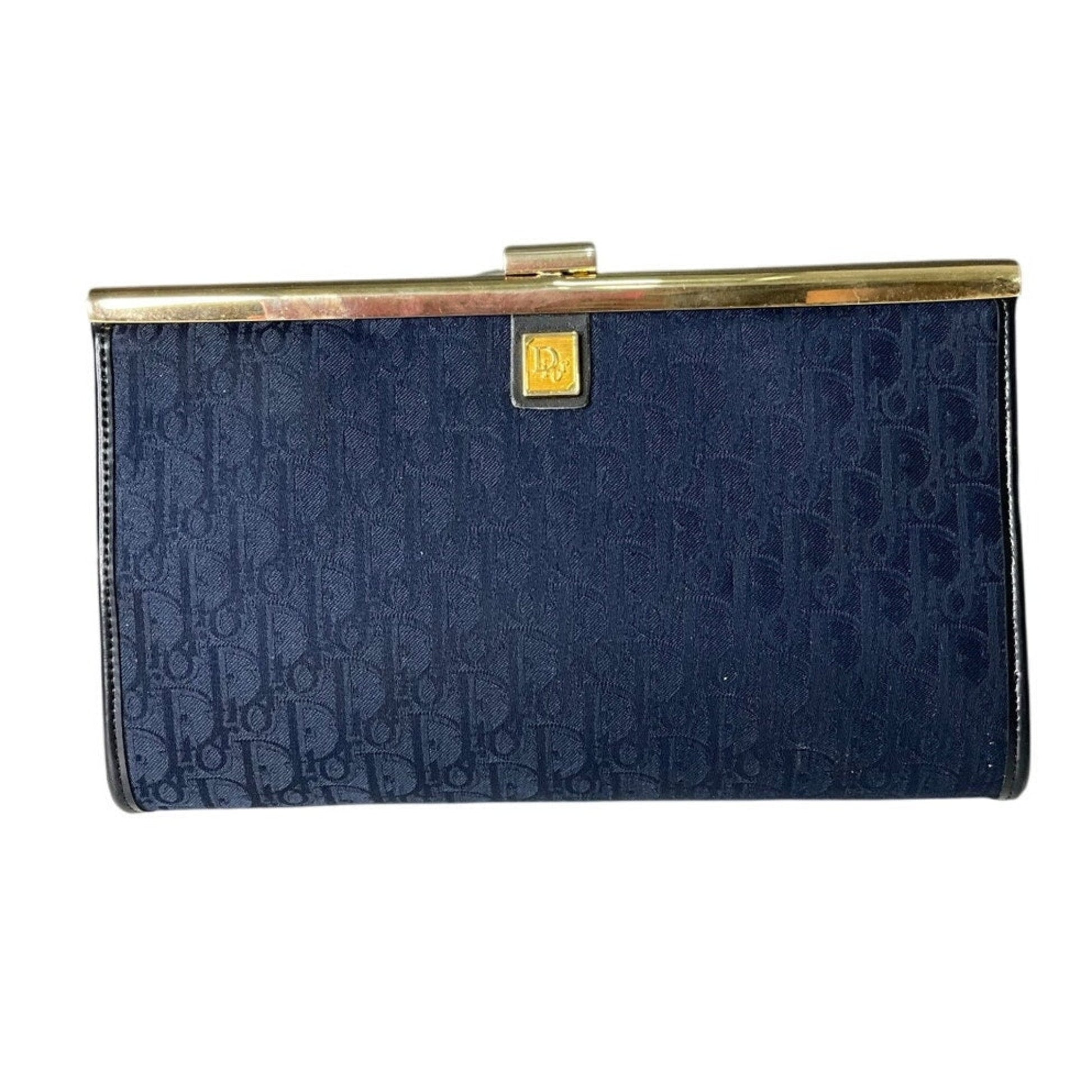 Navy blue clutch bag with gold clasp on a white background