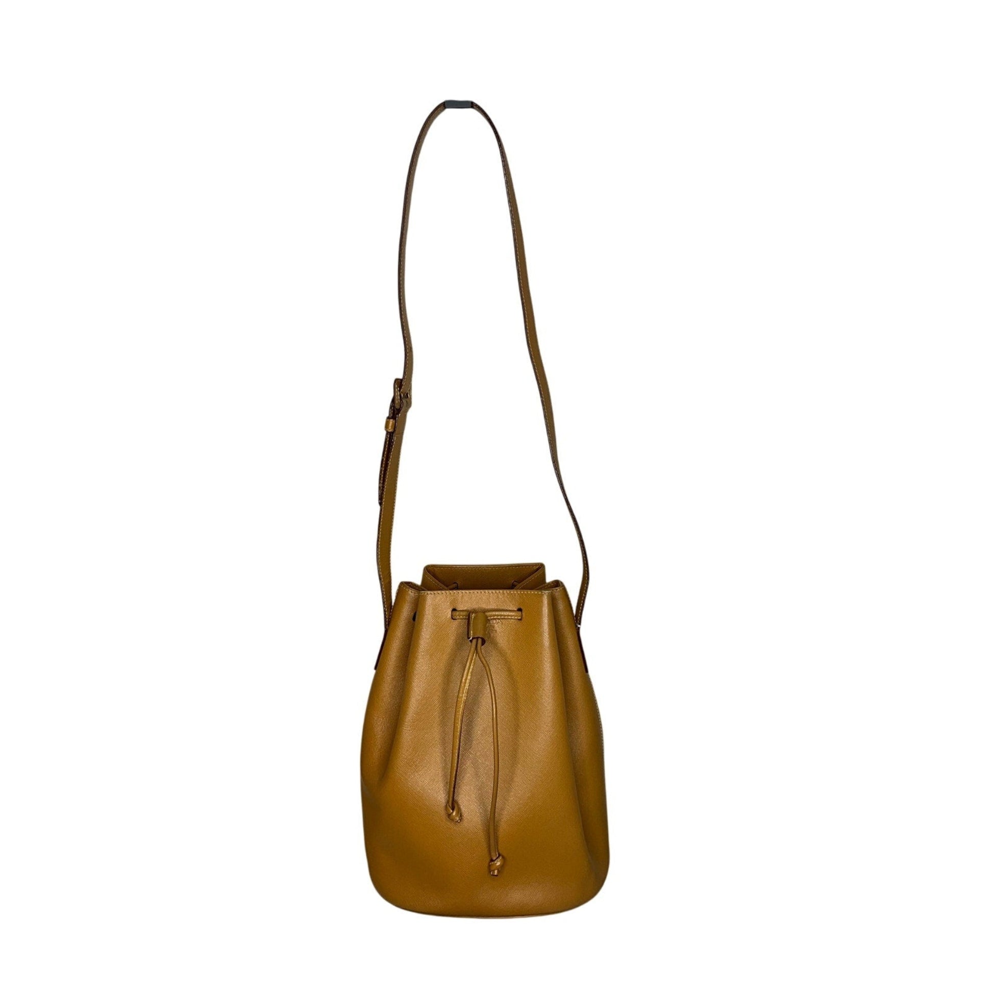 Brown leather bucket bag on a white background