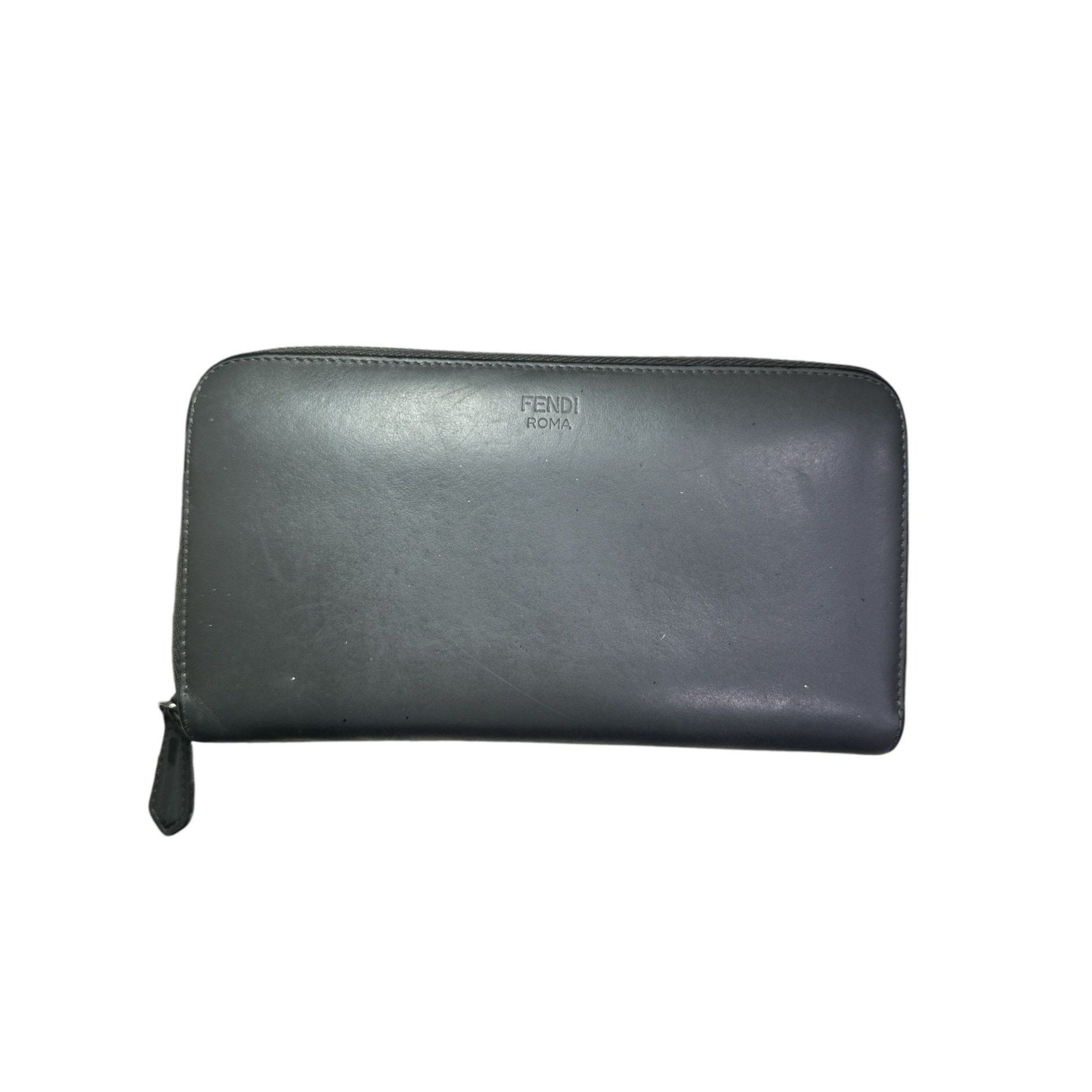 Black leather wallet with Fendi logo on a white background
