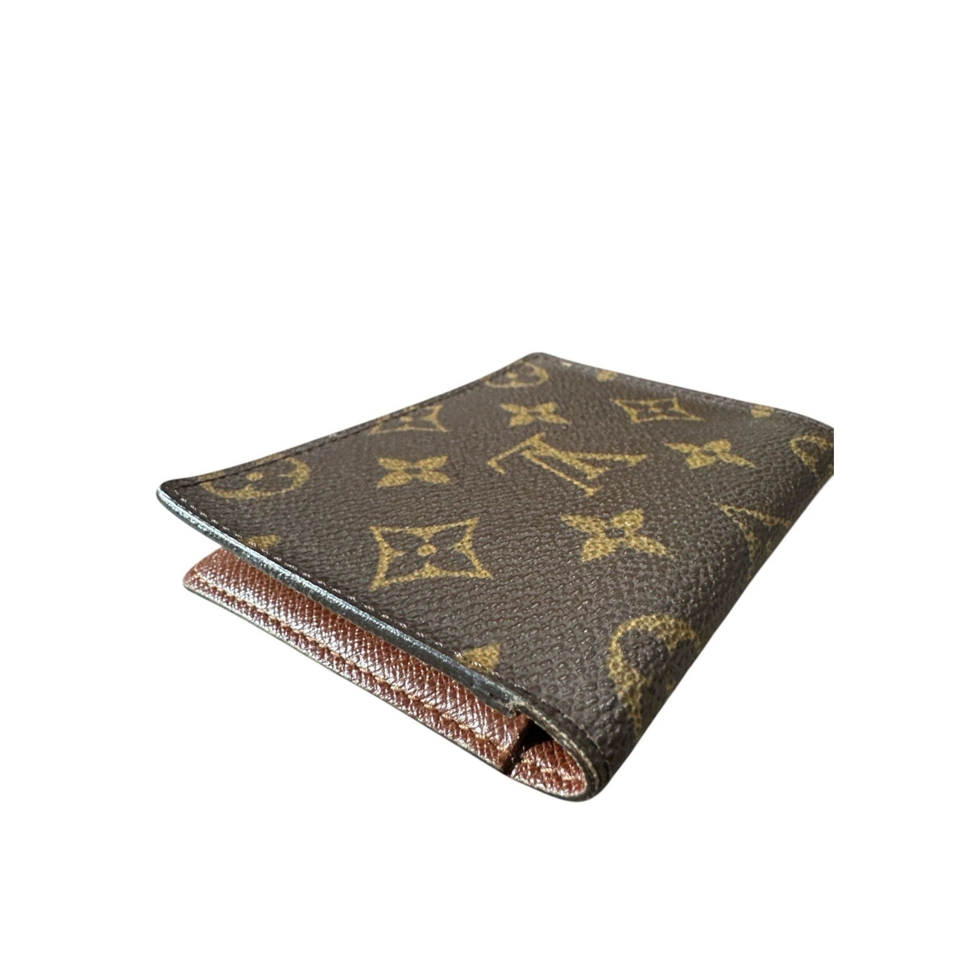 Louis Vuitton wallet with monogram pattern on a white background