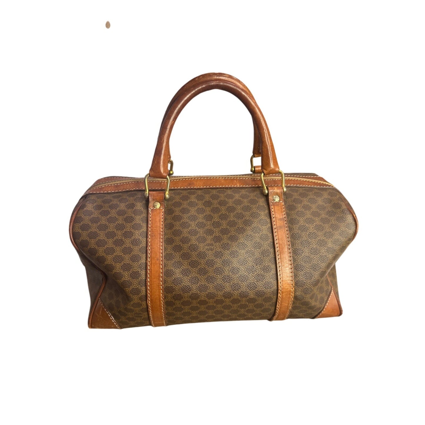 Brown handbag with patterned design and leather accents on a white background