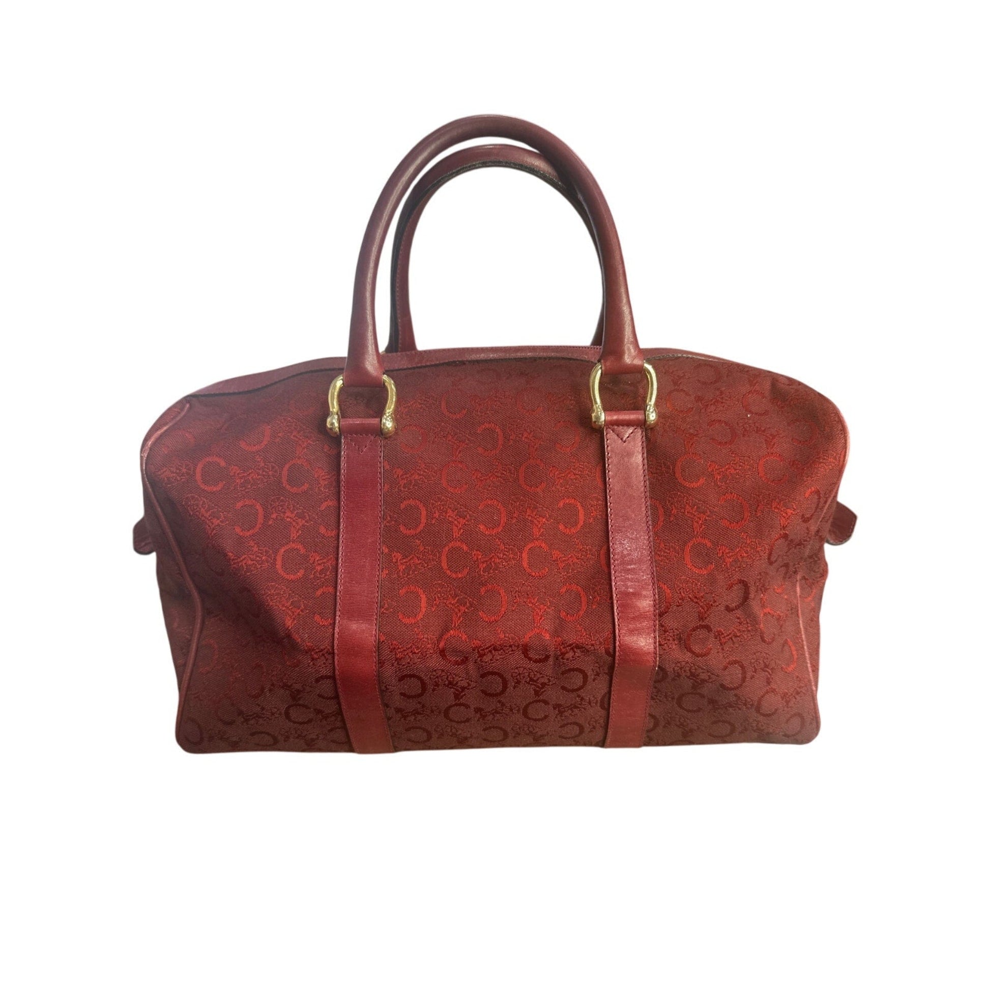 Red patterned handbag on a white background