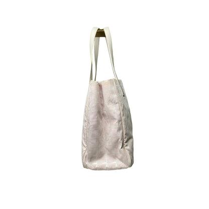 Beige tote bag with a textured pattern on a white background