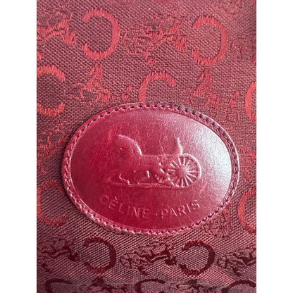 Close-up of a Céline bag with logo and text on a red background