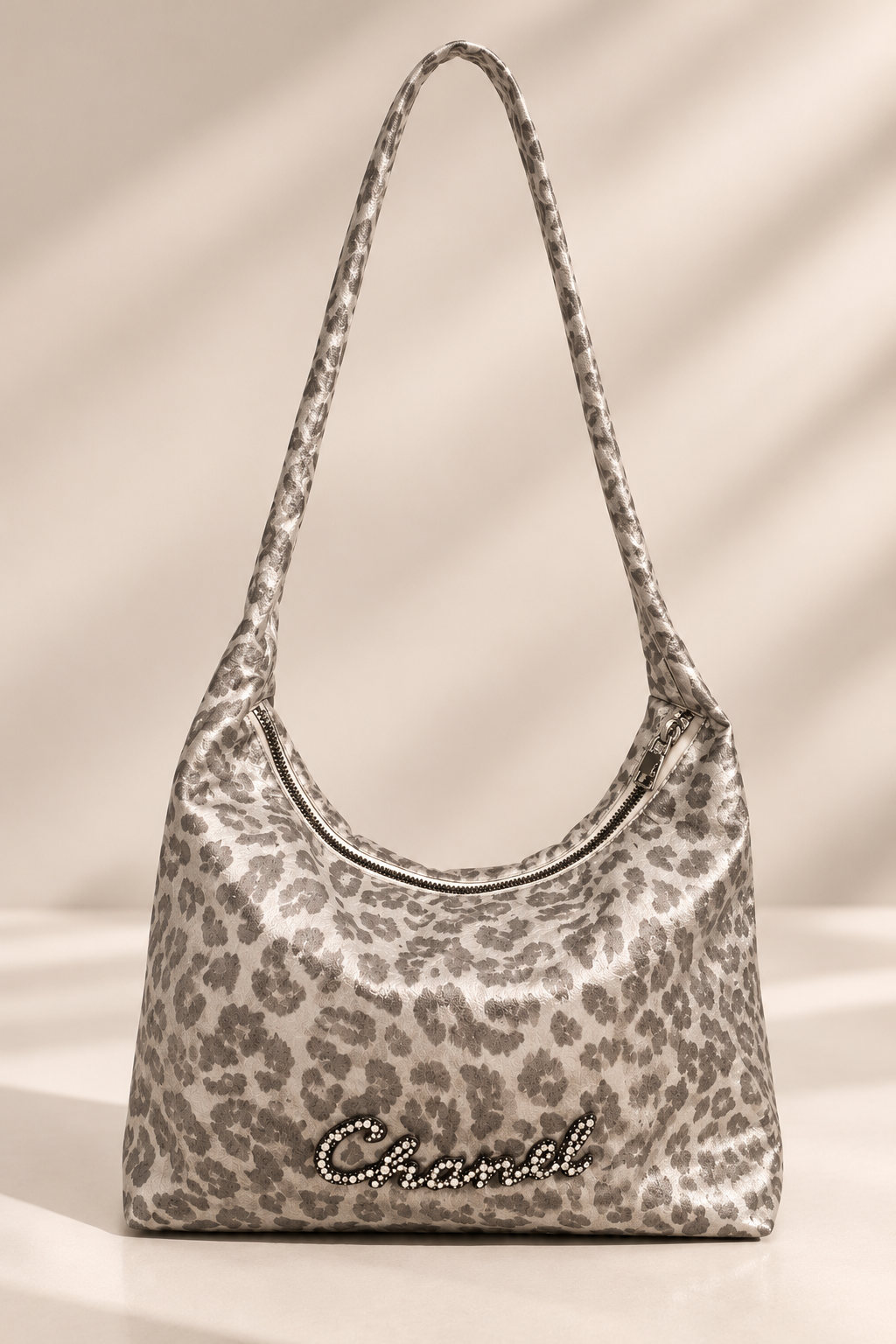 Silver-gray leopard print shoulder bag studio product photograph